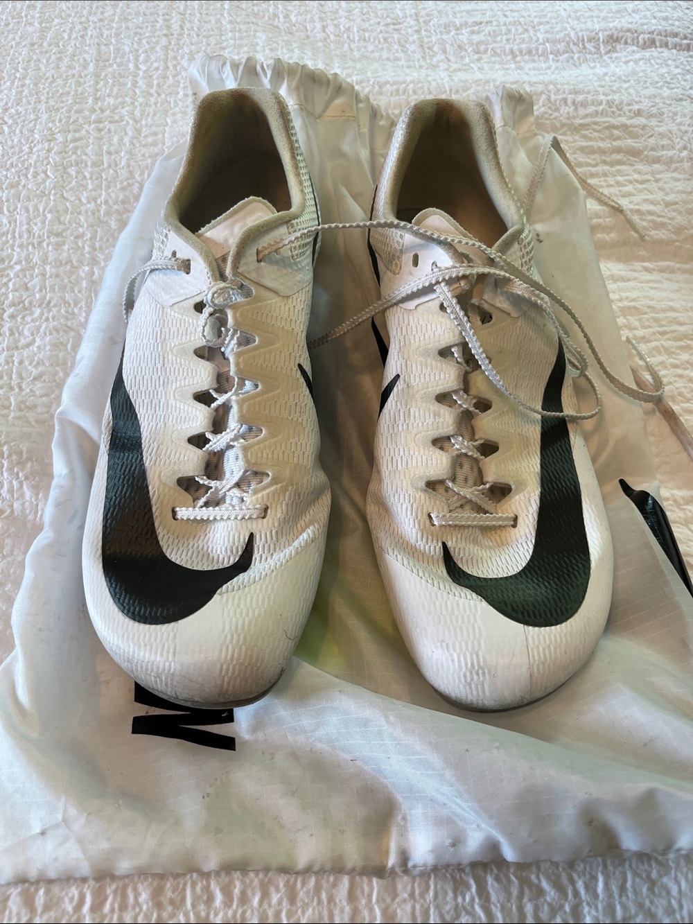 Nike Men’s 10.5 White Sprinting Cleats with Black Swoosh